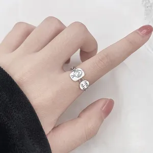 Silver open ring with cartoon character and letter pendant, niche design chic hand jewelry.