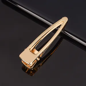 Pince à cheveux clic-clac en métal doré, accessoire géométrique élégant pour le style.