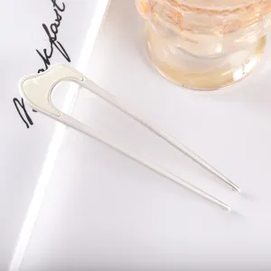 Minimalist U-shaped hair pin detail shot, elegant metal hair stick for traditional Chinese Hanfu styling.