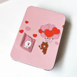 Pink metal tin box with cute cartoon couple print, sweet storage box for hair accessories.