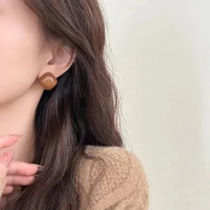 Brown square acrylic resin stud earrings detail shot, chic minimalist fashion jewelry for women.