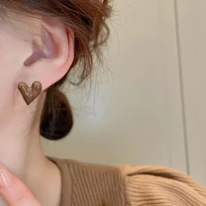 Brown heart stud earrings detailed view, simple chic design for autumn and winter daily wear.