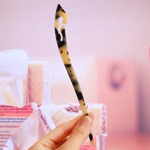 Acetate hairpin detail shot, vintage cloud pattern hair fork, elegant Chinese style bun pin.