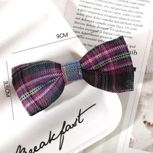 Close-up detail of a chic plaid bow hair clip, stylish JK fabric side clip for daily wear.