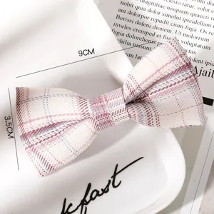 Close-up of the sweet plaid bow hair clip showing fabric texture and cute JK style design.