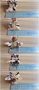 Close-up detail view of the elegant butterfly hair claw showing dimensions with a metal ruler.
