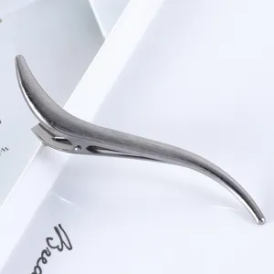 Elegant brushed metal hair clip with a curved S-shape design, perfect for daily styling and updos.