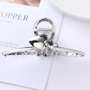 Silver metal hair claw clip with cute double heart design, perfect for secure daily styling.