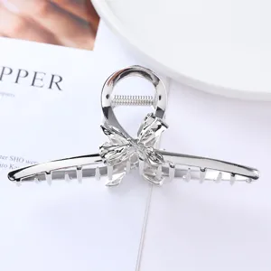 Silver metal hair claw clip with loop and bow design detail for women and girls ponytail styling.