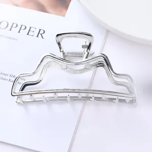 Silver metal hair claw clip, geometric hollow design, elegant ponytail holder for daily use.