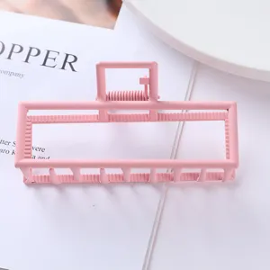 Pink metal rectangular hair claw clip, geometric minimalist design for daily hair styling.