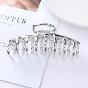 Silver metal hair claw clip minimalist elegant hair accessory for thick hair daily styling.