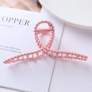 Pink metal hair claw detail, matte finish hair clip for women, stylish ponytail styling accessory.