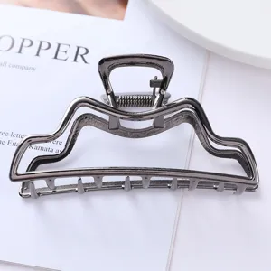 Geometric metal hair claw clip for women, stylish hollow hair accessory for daily styling.