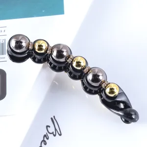 Korean style black banana hair clip detailed with gold silver beads and sparkly rhinestones.