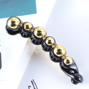 Korean style black and gold pearl banana hair clip with rhinestones for elegant ponytails.