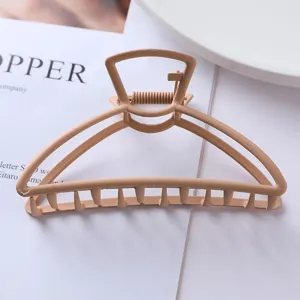 Matte khaki geometric metal hair claw clip detail view, stylish hair accessory for women.