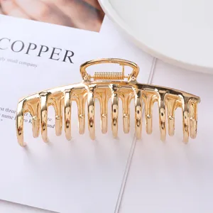 Gold metal hair claw clip for women, strong hold hair accessories for thick hair daily styling.