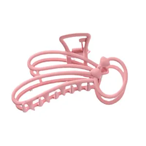 Pink metal hair claw clip with hollow geometric design and cute bow for women daily styling.
