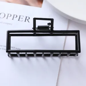 Black geometric metal hair claw clip detail, stylish square hollow hair accessory for women.