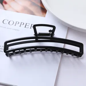Matte black metal hair claw clip, minimalist geometric design for daily hair styling.