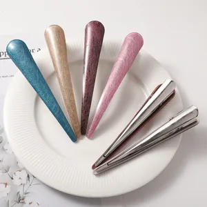 Detailed view of colorful acetate and metal hair clips, elegant hair accessories for styling.