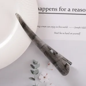 Grey acetate hair clip for women, elegant marbled design horn clip for styling hair securely.