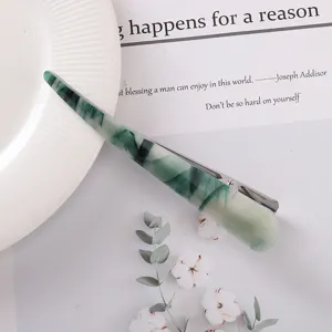 Close-up of green marble acetate duckbill hair clip, elegant design for daily styling.