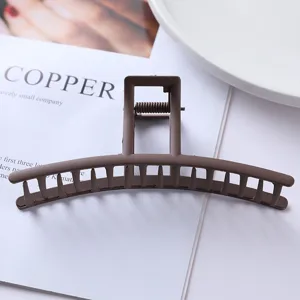 Minimalist matte brown metal hair claw clip, sturdy geometric design for elegant daily hairstyles.