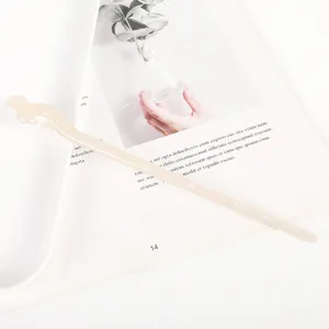 Detailed view of the elegant acetate hair stick with hollow carved design, perfect for hair styling.