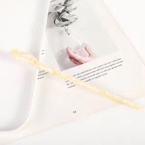 Detailed view of a minimalist hollow acetate hair stick, elegant chinese style hair accessory.