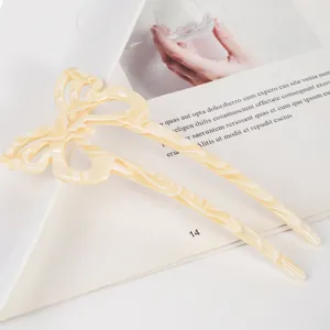 Beige acetate butterfly hair fork detailed view, elegant hollow hair accessory pin.
