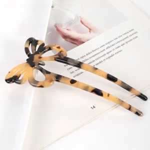 Tortoiseshell butterfly hair fork detail, elegant acetate hair accessory for women styling.