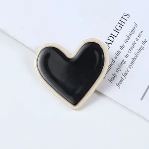 Black white heart acrylic hair clip detail shot, elegant daily hair accessory for women.