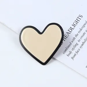 Heart shaped acrylic side hair clip detail view, minimalist black and white hair accessory.