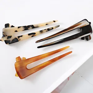 Acetate hair fork with hollow bow design, elegant tortoiseshell hair stick for buns.