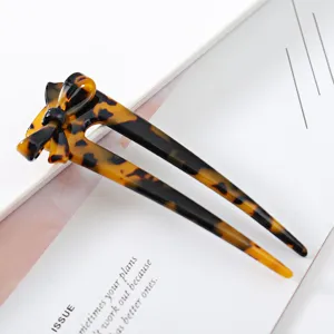 Tortoise shell acetate hair stick with bow, elegant hair fork for bun and updo styling.