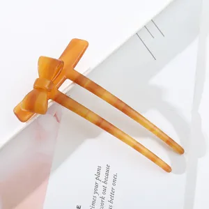 Bernsteinfarbene Acetat Schleife Haargabel elegante hohle Haarnadel für Dutt Vintage Styling