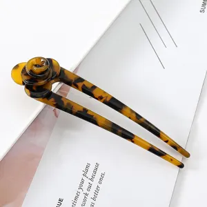 Tortoise shell acetate U-shaped hair fork with 3D flower, elegant detail view.