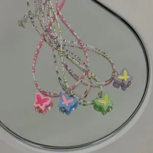 Colorful seed bead butterfly necklace sweet cool Y2K style choker jewelry accessory for women.