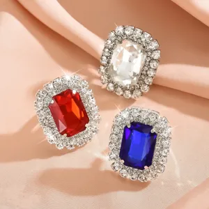 Luxurious large rectangular crystal statement cocktail rings featuring sparkling rhinestone halos.