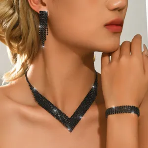 Detail shot of black rhinestone necklace earrings and bracelet sparkling close-up view