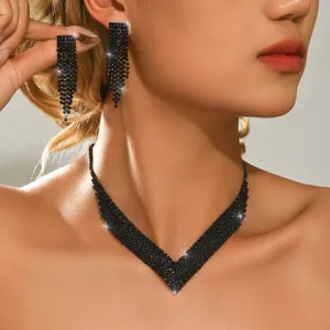 Black rhinestone tassel earrings and V necklace set detail view, elegant evening jewelry.