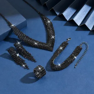 Exquisite black rhinestone jewelry set detail showing sparkling necklace, earrings, bracelet.