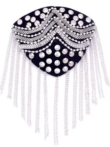 Close-up of rhinestone rivet tassel epaulet, glamorous stage costume accessory.