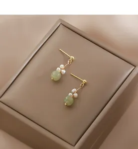 Exquisite Chinese style jade bead and pearl drop earrings, elegant gold-tone post design.