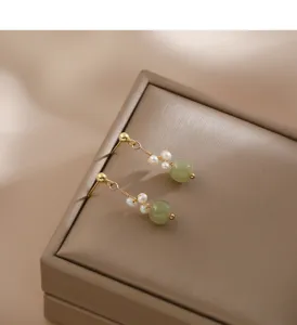 Exquisite Chinese style dangle earrings with pearls and green jade-like beads for women.