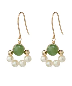 Exquisite Chinese style jade and pearl dangle earrings, minimalist design jewelry detail shot.