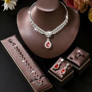 Closeup view of a gorgeous crystal jewelry set with red drop stones and matching accessories.