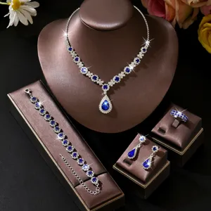 Stunning blue rhinestone bridal jewelry set featuring necklace bracelet earrings and ring.
